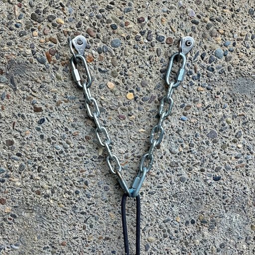 Two bolts with chains joined at the bottom by a single quick link, through which the rope runs.